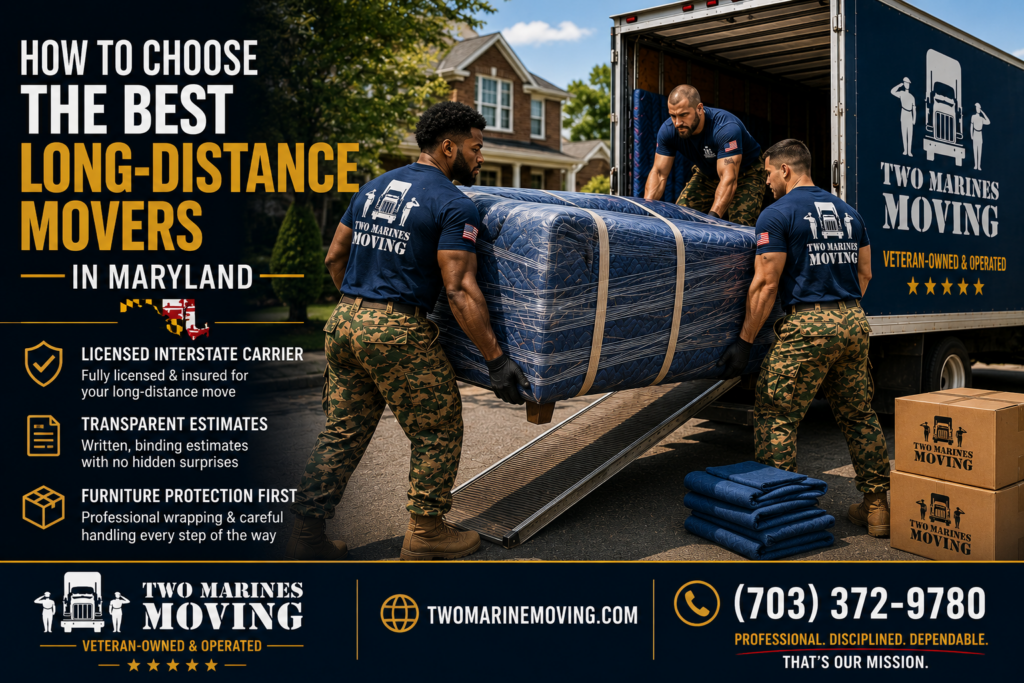 Two Marines Moving crew carrying a heavily wrapped sofa during a long-distance move in Maryland.